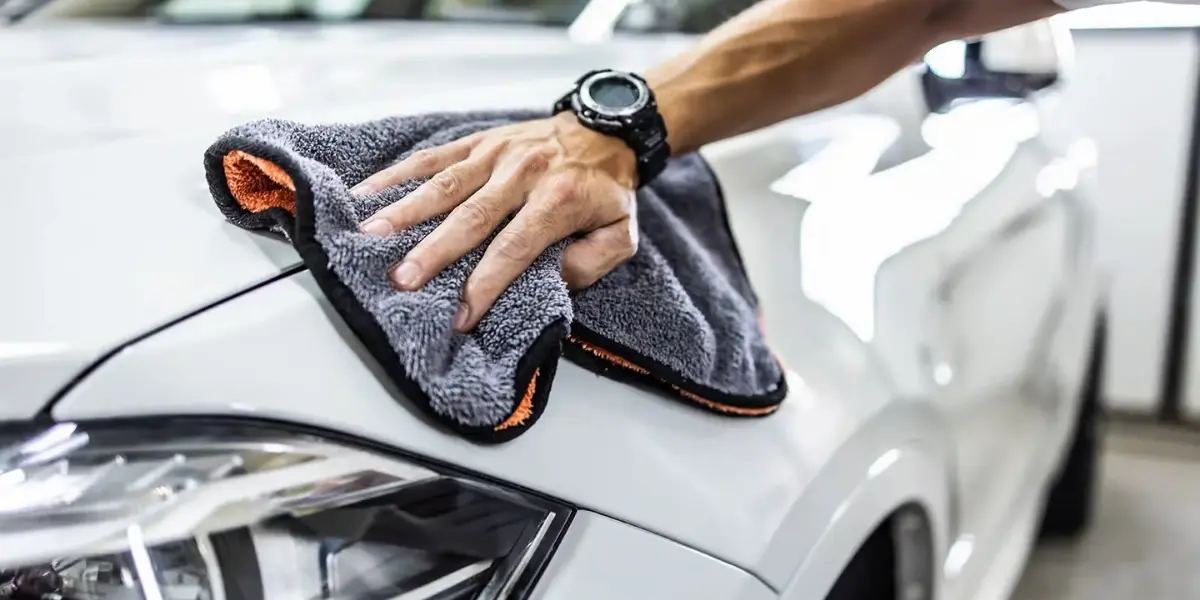 drying a car with a microfiber towel