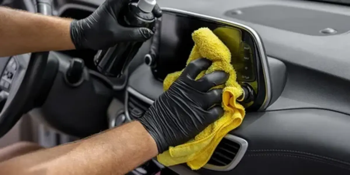 safe car germ cleaning on infotainment touchscreen and dashboard