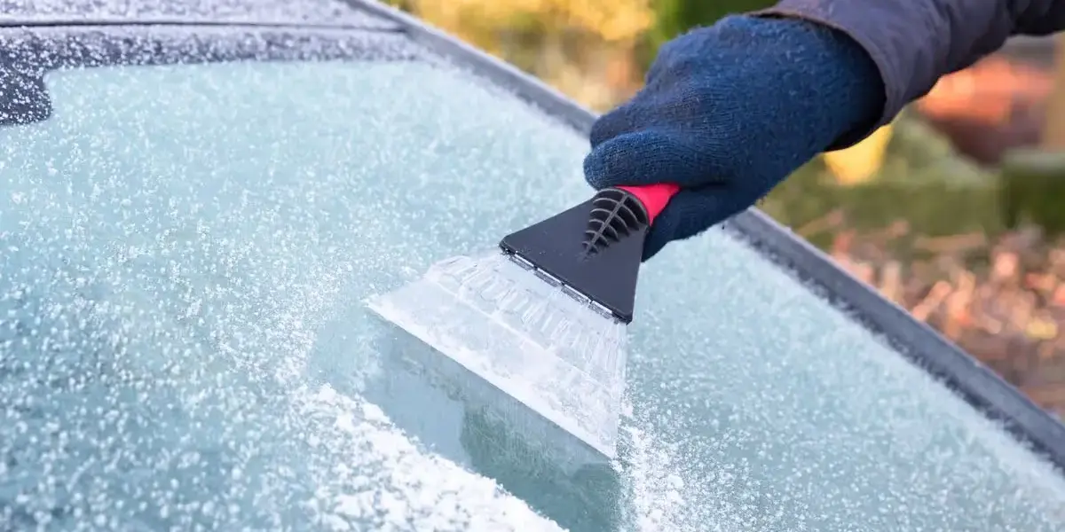 Car covered in heavy ice and frost on a cold winter morning