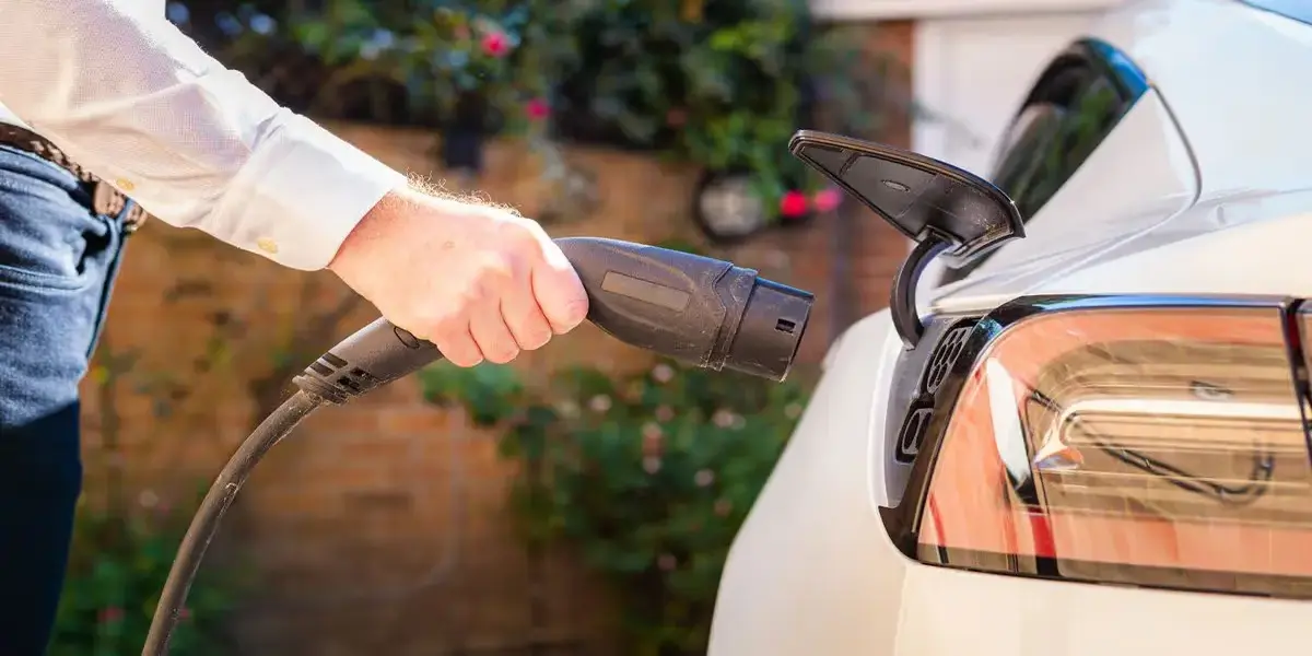 Side profile of a hybrid Toyota Corolla badge highlighting high city and highway fuel efficiency.