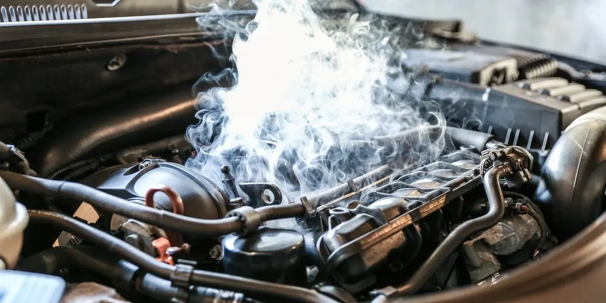A labeled diagnostic illustration showing cabin, engine bay, rear fuel tank, and tailpipe.