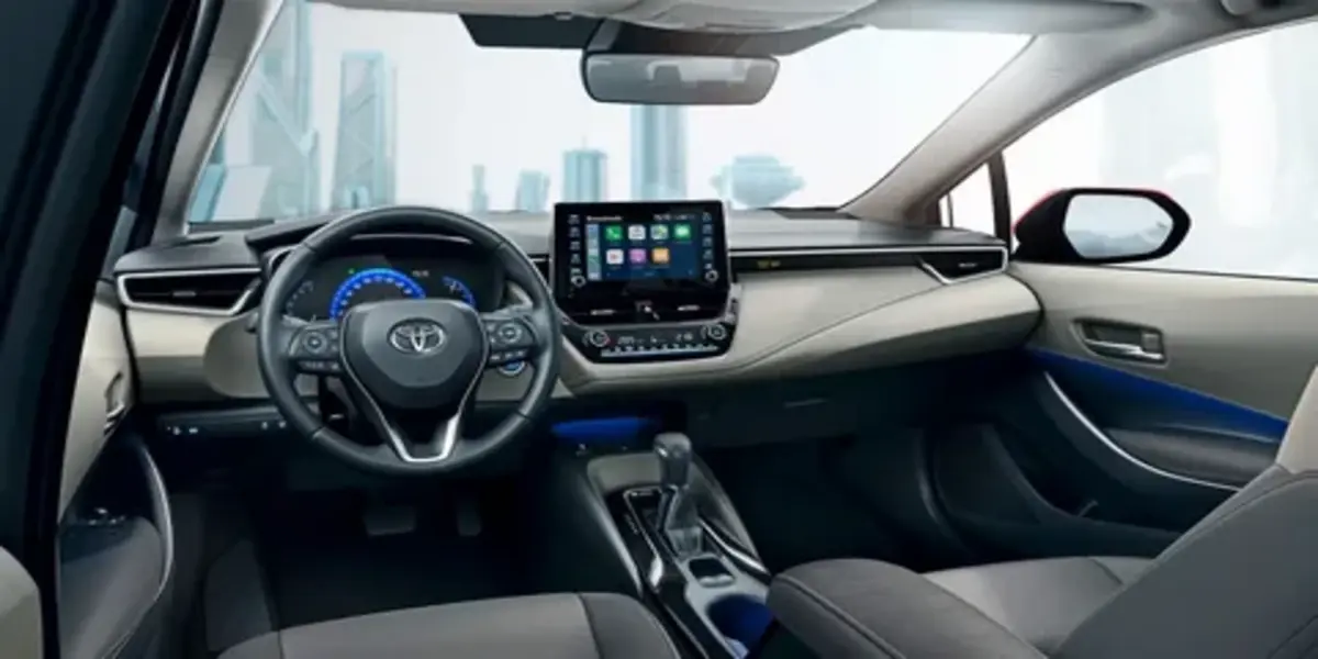 Interior view of a Toyota Corolla showing dashboard and infotainment display
