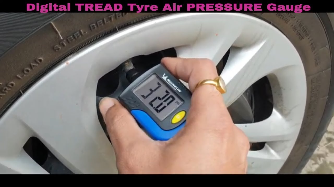 Checking tire pressure using a pressure gauge on a car tire.