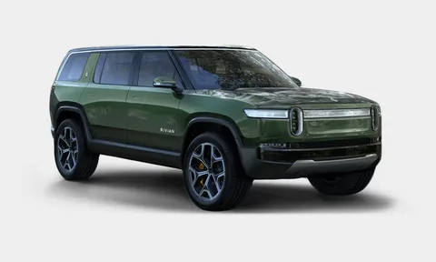 A forest green Rivian R1S electric SUV positioned against a plain white background.