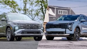 Hyundai Tucson Hybrid and Kia Sorento Hybrid SUVs parked side by side on a snowy driveway.