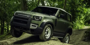 Defender 110 on a dramatic road/off-road landscape